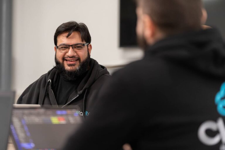 Masi talking to a colleague