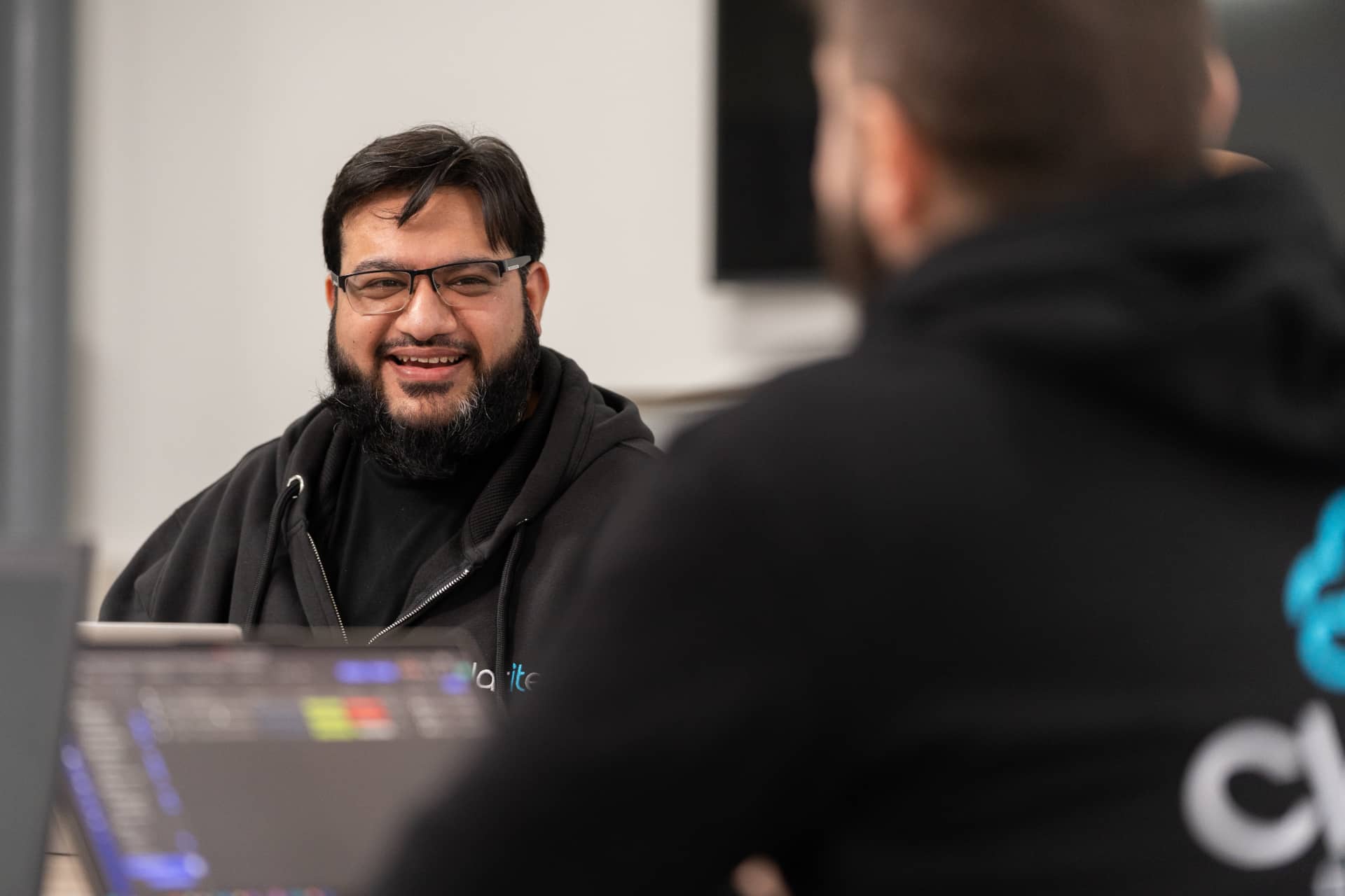 Masi talking to a colleague